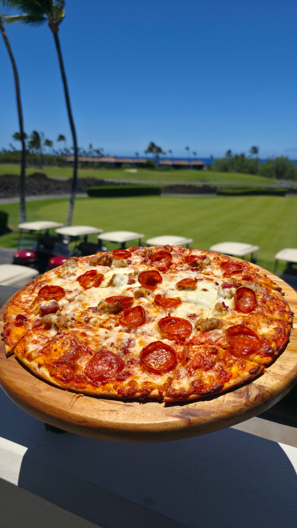 BIG Pizza Big Island Beast baked fresh at the Clubhouse Bar with ocean view